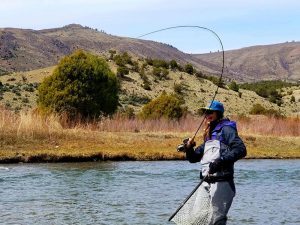 woman fly fishing in colorado