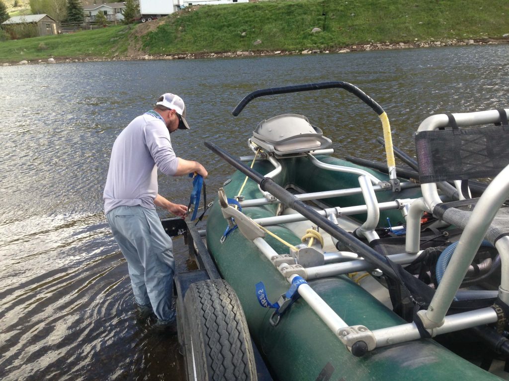 13477-Eagle River vail Fishing Report-man with his boat