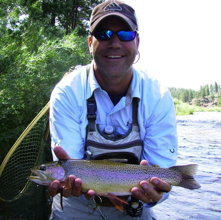 2503-Client Shawn Miller with a healthy Cutbow in the lower river