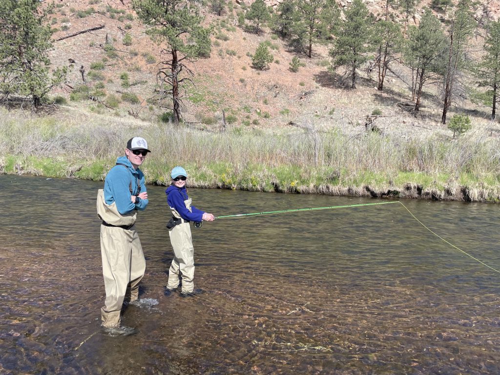 So, you’ve decided to teach your kids to fly fish., dad and son fly fishing in river